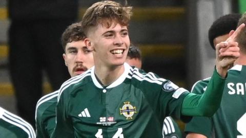 Isaac Price celebrates after putting Northern Ireland ahead against Denmark