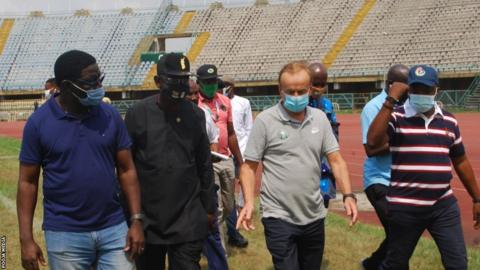 Nigeria coach Gernot Rohr inspects the facilities at the Teslim Balogun stadium with other officials