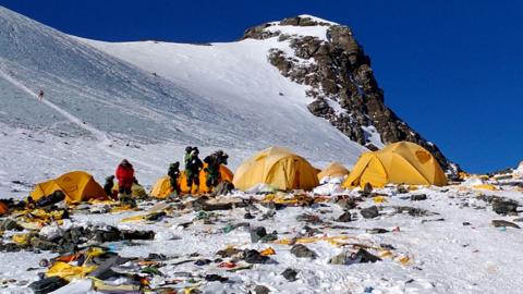 Discarded climbing equipment and rubbish scattered around Camp 4 of Mount Everest