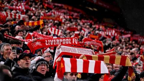 Liverpool fans display their scarves at Anfield