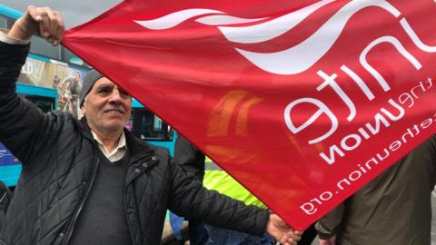 Arriva worker with union banner