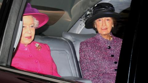 Lady Hussey in a car with the late Queen