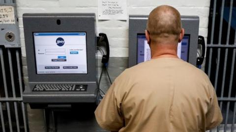 An inmate in New Jersey demonstrates JPay, an online network used by prisoners