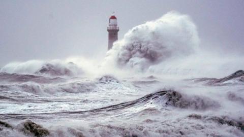 Big waves break over sea wall at Roker