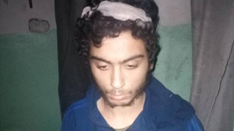 Yusuf Zahab with a bandage on his head