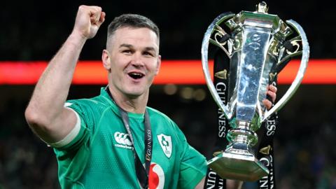 Ireland fly-half Johnny Sexton lifts the Six Nations trophy