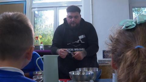 Chef 'Big Has' teaches children how to cook
