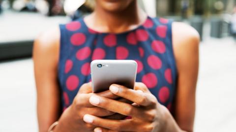 woman holding phone