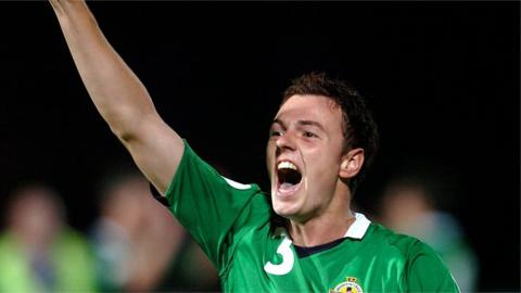 Jonny Evans celebrates Northern Ireland's 3-2 win over Spain