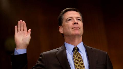 FBI Director James Comey is sworn in before testifying to a senate committee.