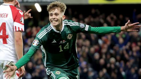 Isaac Price joyously celebrates after putting Northern Ireland ahead against Denmark