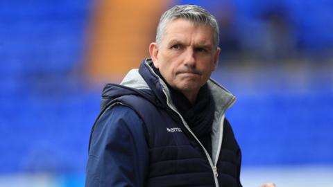 John Askey watches on