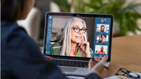 Stock shot of woman on computer screen