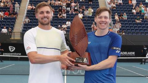 Lloyd Glasspool (L) and Harri Heliovaara (R) pose with the Adelaide International doubles trophy