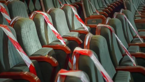 Theatre seats blocked off with tape