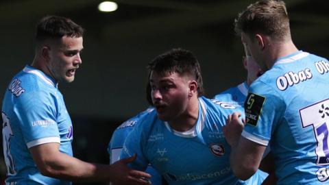 Santiago Socino celebrates his first try for Gloucester against Dragons