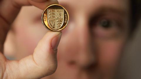 Man holding coin