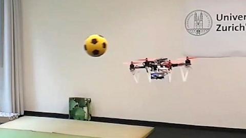 The drone avoids a football