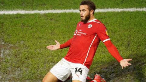 Carlton Morris celebrates scoring Barnsley's first goal