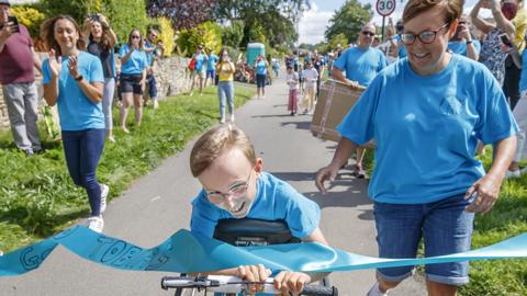 Tobias Weller crosses finishing line