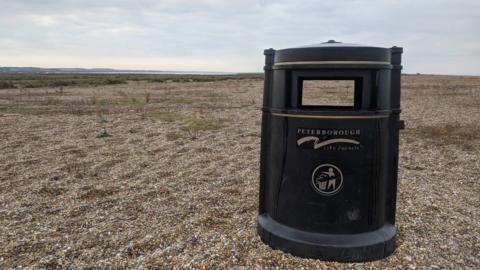 A bin on a beach