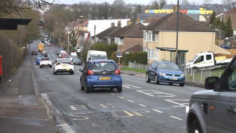 Cars heading down Muller Road in Bristol