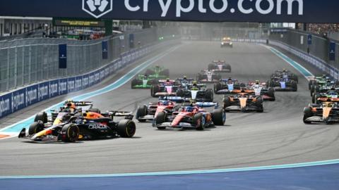 Max Verstappen leads at the first corner of the Miami Grand Prix