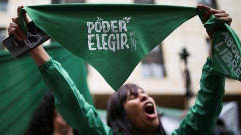 A demonstrator reacts after Colombia"s constitutional court voted to decriminalize abortion until 24 weeks of gestation, in Bogota, Colombia February 21, 2022.