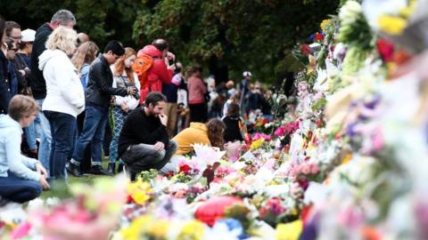 People lay flowers in Christchurch