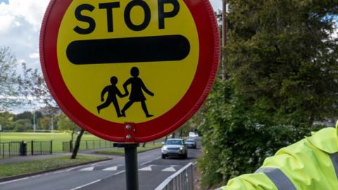 Lollipop man with sign - generic