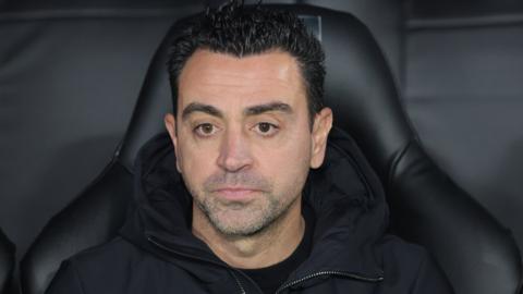 Xavi on the bench during a Barcelona game