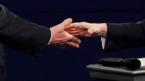 The hands of Republican U.S. presidential nominee Donald Trump and Democratic U.S. presidential nominee Hillary Clinton are seen as they shake hands at the end of their presidential town hall debate