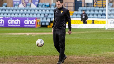 Referee Don Robertson at Dens Park