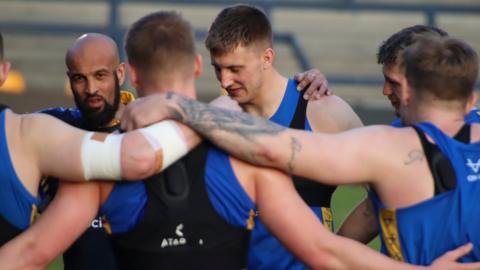 Jamie Jones-Buchanan with the Leeds players