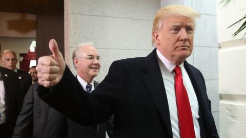 Donald Trump gives a thumbs-up after a meeting at the US Capitol.