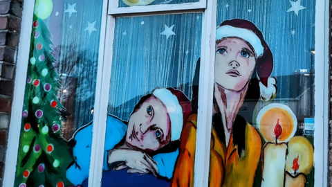 Artwork painted on a window by Bianca Garcia