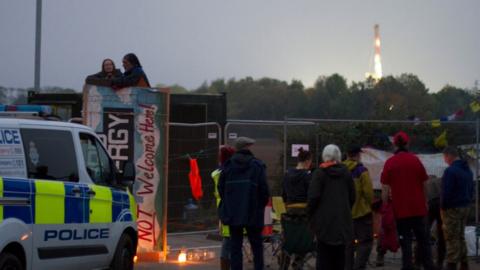 Protesters up the tower