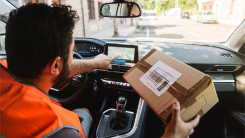 Delivery driver processing a parcel