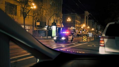 Police car on a dark street
