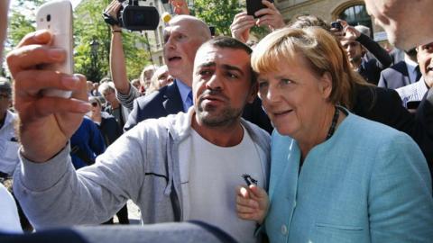 Angela Merkel meets refugees in Berlin (file pic Sept 2015)