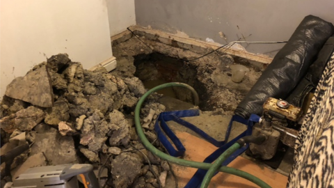 A photo of the water-filled hole in the living room