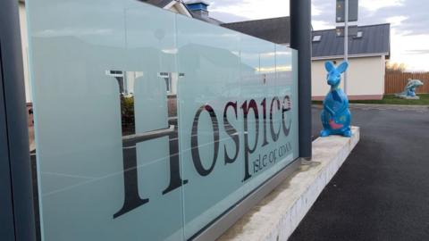 A photo of the Hospice sign