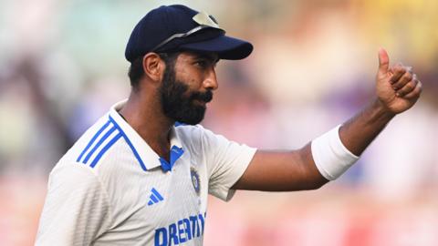 India bowler Jasprit Bumrah gives a thumbs up after taking six wickets