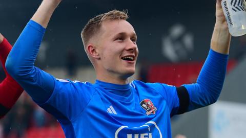 Viljami Sinisalo celebrates an Exeter City win