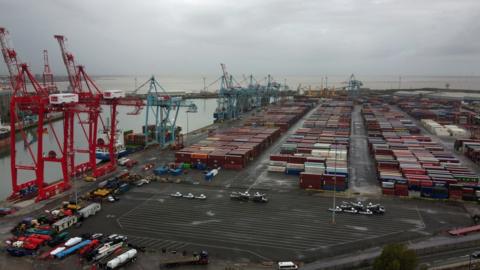 General view of stacked shipping containers at Peel Ports Liverpool docks in Liverpool