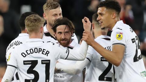 Joe Allen celebrates with his team-mates