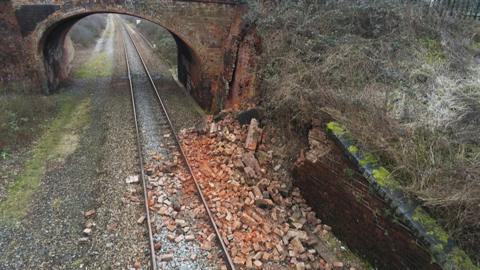 Bricks on a rail track from a collapsed wall in Yarnton,