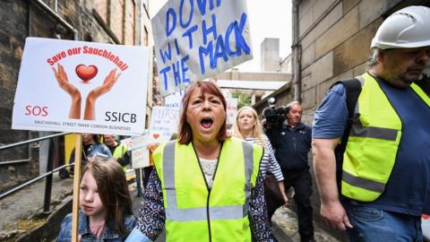 Mackintosh protests
