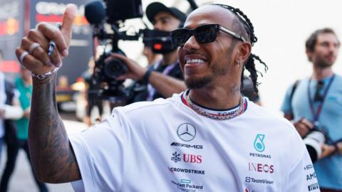 Lewis Hamilton gives a thumbs up to the fans in Monaco