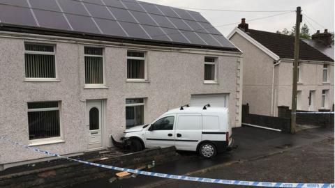 A car crashed into a house in Cross Hands